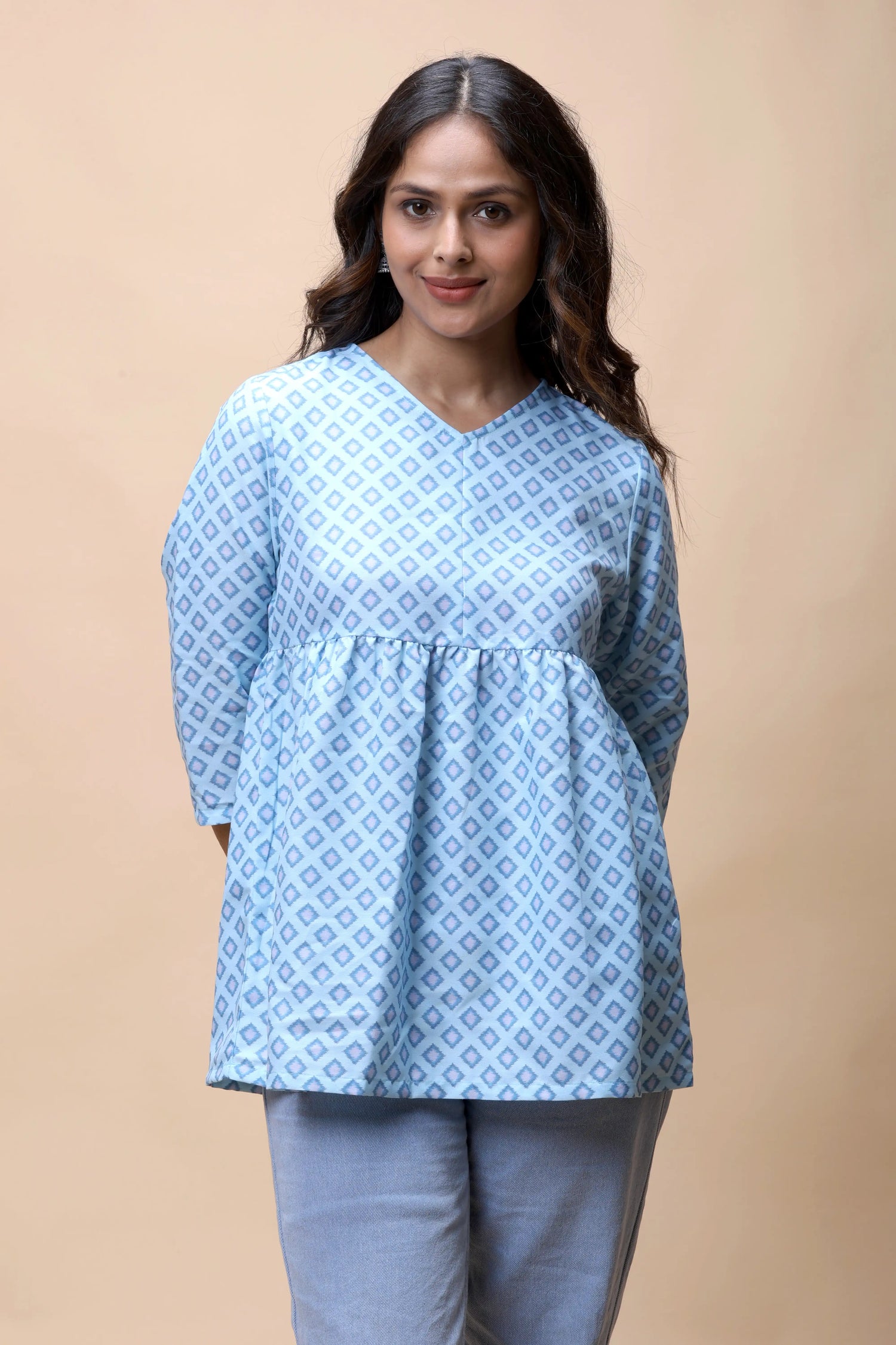 Aqua blue ikkat print peplum short kurti for a professional daily work look.