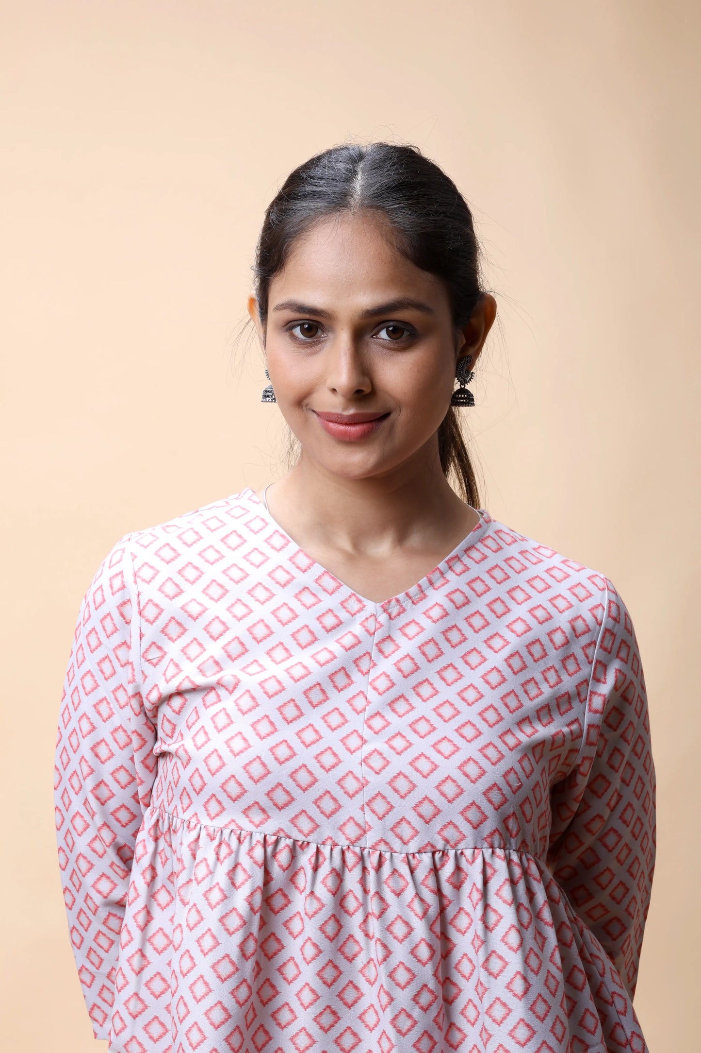 Shop Pink Ikkat Print Peplum Short Kurti For Women online at allthere.in